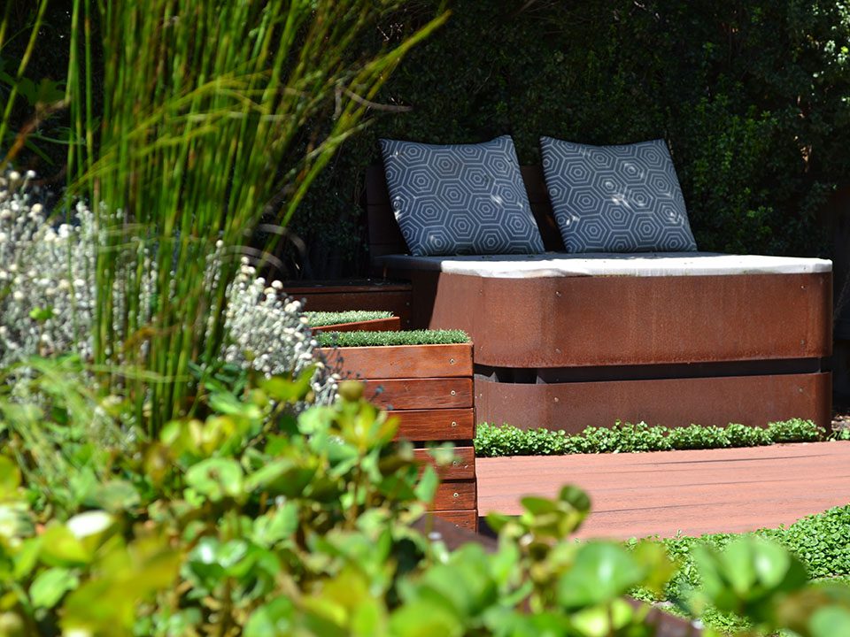 Contemporary backyard with daybed and seats